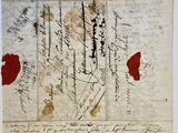un vieux document écrit posé sur une table