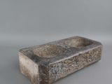 an image of a stone sink on a white surface