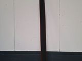 a wooden bat leaning against a wall in a room