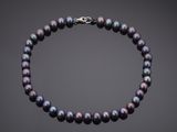 a black pearl necklace with a silver clasp