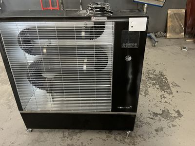 a black and silver fan sitting on top of a table