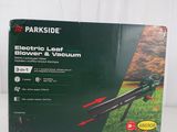 a box of electric lawn mowers sitting on top of a table