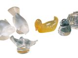 a group of glass figurines of different shapes and sizes
