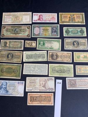 several different types of paper money laid out on a table