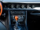 a close up of a car dashboard with a steering wheel