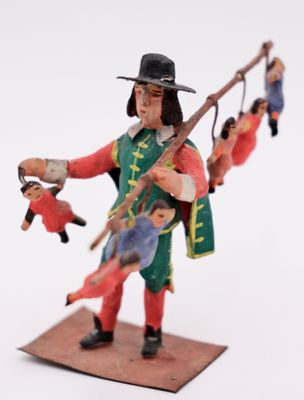 a figurine of a man with a sword and other figures