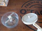 a wooden table with a blender and other items on it