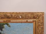 an oil painting of a landscape with a river and trees in a gold frame