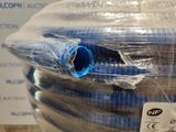 several rolls of blue and white hoses wrapped in plastic