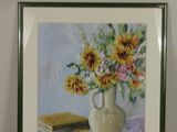 a picture of a painting of sunflowers in a vase on a table