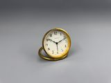 a small clock that is sitting on a table