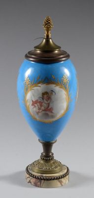 pair of blue and gold vases with angels on them