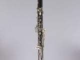 a close up of a clarinet on a clear surface