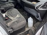 the interior of a car with the door open and the seats down