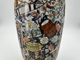 a vase that has a picture of people on it
