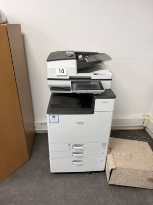 a photo of a multi - function printer in a room