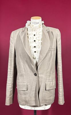 the jacket is made of linen and has buttons on the lapel