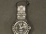 a watch that is sitting on a table with a tag