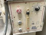 a machine that is sitting in the corner of a room
