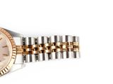 an image of a woman ' s wrist watch with two tone bracelets