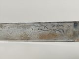 a knife that is sitting on top of a table
