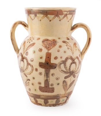 a vase that is sitting on a white surface