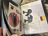 a person holding an open book with a picture on it