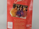 the back of a red box with a picture of a barbie doll and other dolls