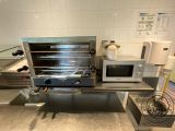 an image of a kitchen with a toaster oven and microwave