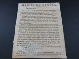 an old piece of paper with writing on it sitting on a table