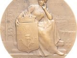 une image représentant une médaille de bronze sur laquelle figure une femme assise sur un banc