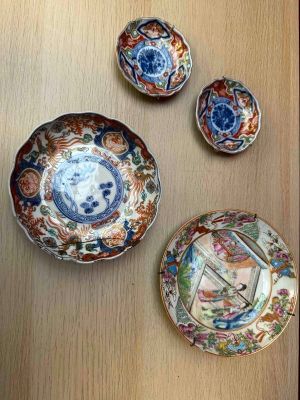 many different plates and bowls on the table