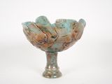 a small glass bowl that is sitting on a table