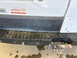 a close up of a truck bumper with a sticker on it