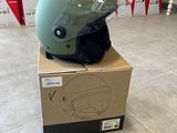 a green helmet on top of a box on the floor