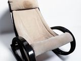 an image of a black and white rocking chair against a white wall