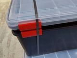 two plastic storage boxes sitting on top of each other