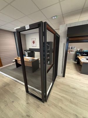 an image of an office cubicle with a glass door