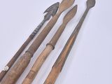 several different types of tools are sitting on a white surface