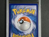 a close up of a pokemon card on a black surface