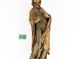 statue of a man in a robe holding a bag and a green tag