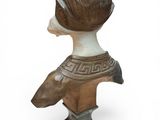 statue of a woman with a dog on her head