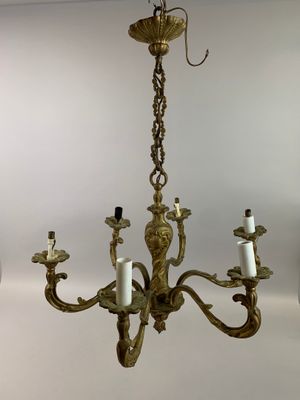 LUSTRE en bronze à six branches formées de volutes et d'enro…