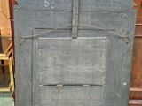 a wooden door with a number on it in a room