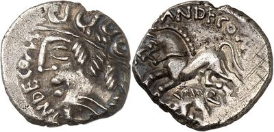 a silver coin with an image of a man on it