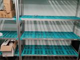 a shelf with boxes and boxes on it in a room