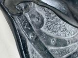 a close up of a fish on a metal object