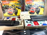 two boxes of racing games on a table