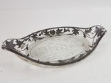 a glass bowl with a black and white design on it