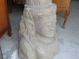 a statue of a woman with a headdress on it